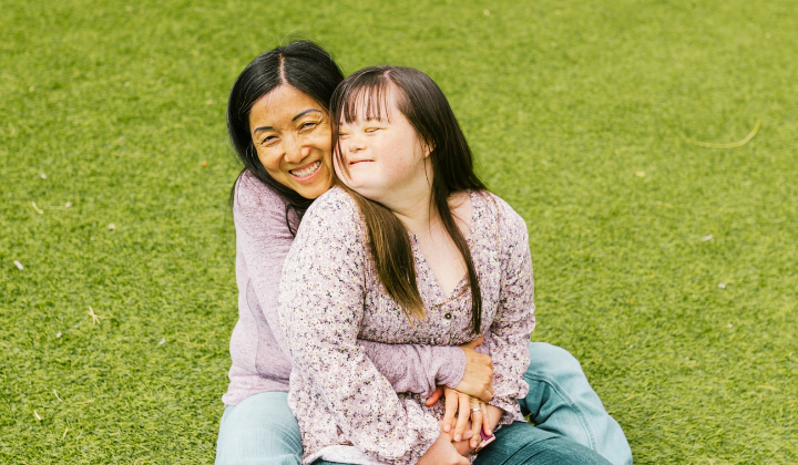 Mom Hugging Daughter with Down Syndrome